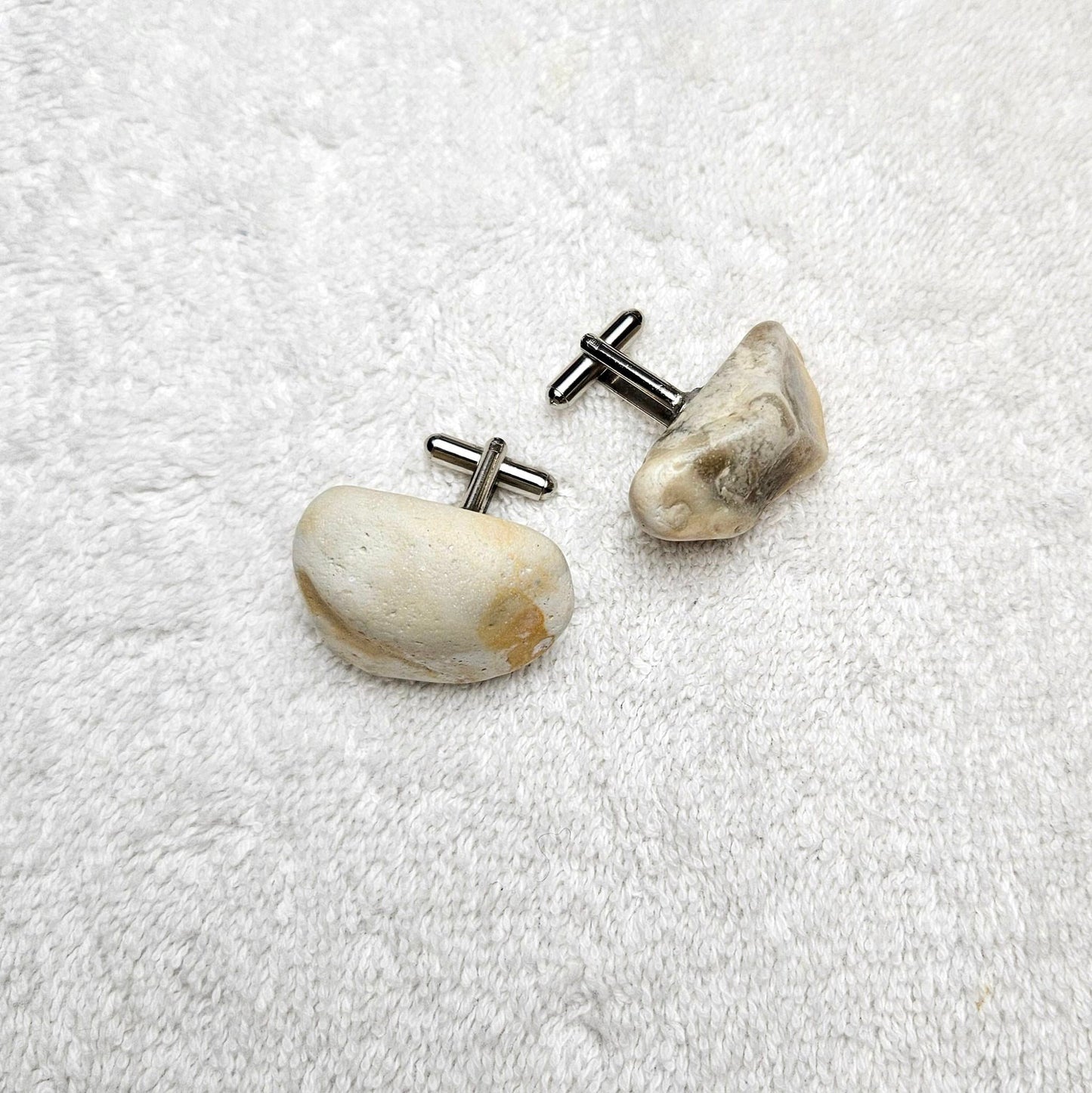 Image shows Brighton Rocks! Cufflinks designed by barnardandjestico . Stylish Cufflinks of natural polished stone ; from handmade process at my studio in Brighton Sussex England. For Menswear to show individual flair . Bold-sized ( 2-to-4cm ) natural shaped stones specialist-waxed and polished , then set on steel-studs . Homemade artisan methods of natural environmental materials