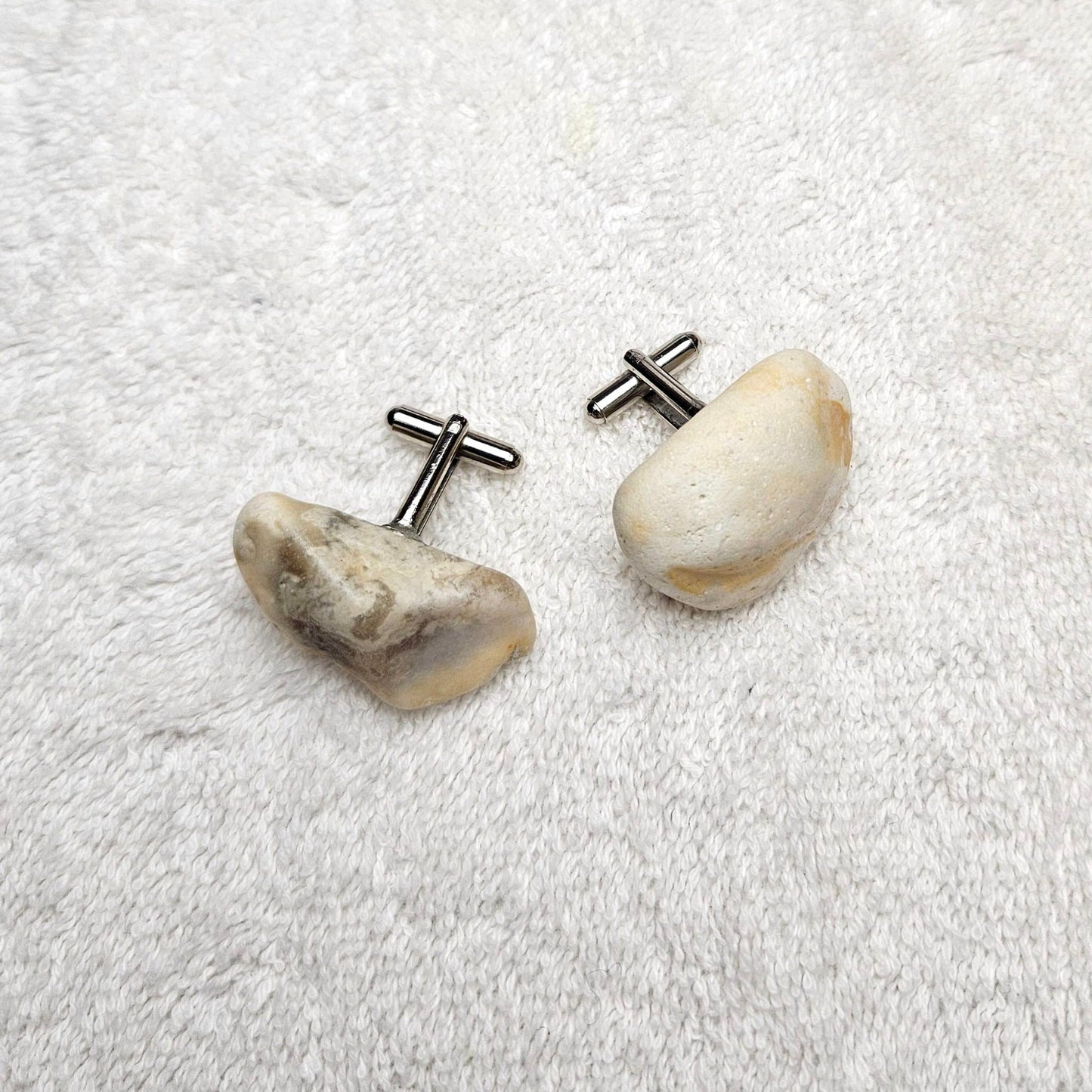 Image shows Brighton Rocks! Cufflinks designed by barnardandjestico . Stylish Cufflinks of natural polished stone ; from handmade process at my studio in Brighton Sussex England. For Menswear to show individual flair . Bold-sized ( 2-to-4cm ) natural shaped stones specialist-waxed and polished , then set on steel-studs . Homemade artisan methods of natural environmental materials