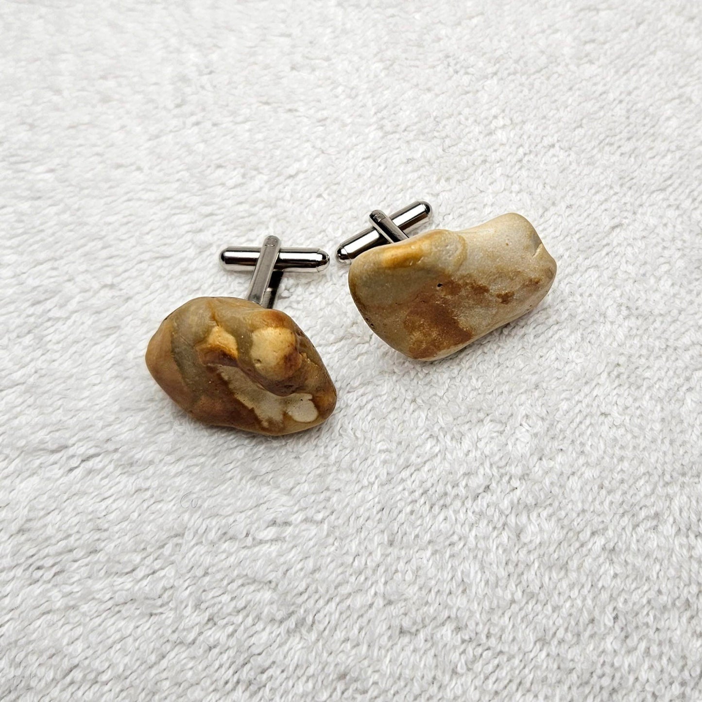 Image shows Brighton Rocks! Cufflinks designed by barnardandjestico . Stylish Cufflinks of natural polished stone ; from handmade process at my studio in Brighton Sussex England. For Menswear to show individual flair . Bold-sized ( 2-to-4cm ) natural shaped stones specialist-waxed and polished , then set on steel-studs . Homemade artisan methods of natural environmental materials