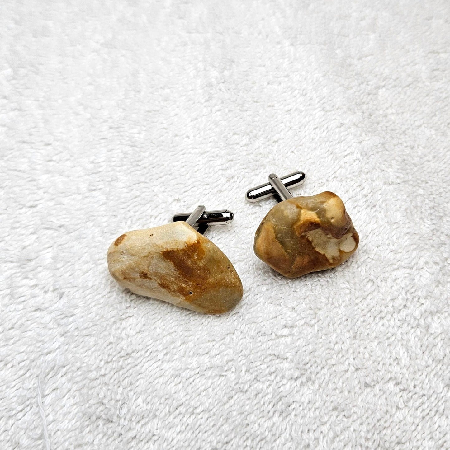 Image shows Brighton Rocks! Cufflinks designed by barnardandjestico . Stylish Cufflinks of natural polished stone ; from handmade process at my studio in Brighton Sussex England. For Menswear to show individual flair . Bold-sized ( 2-to-4cm ) natural shaped stones specialist-waxed and polished , then set on steel-studs . Homemade artisan methods of natural environmental materials