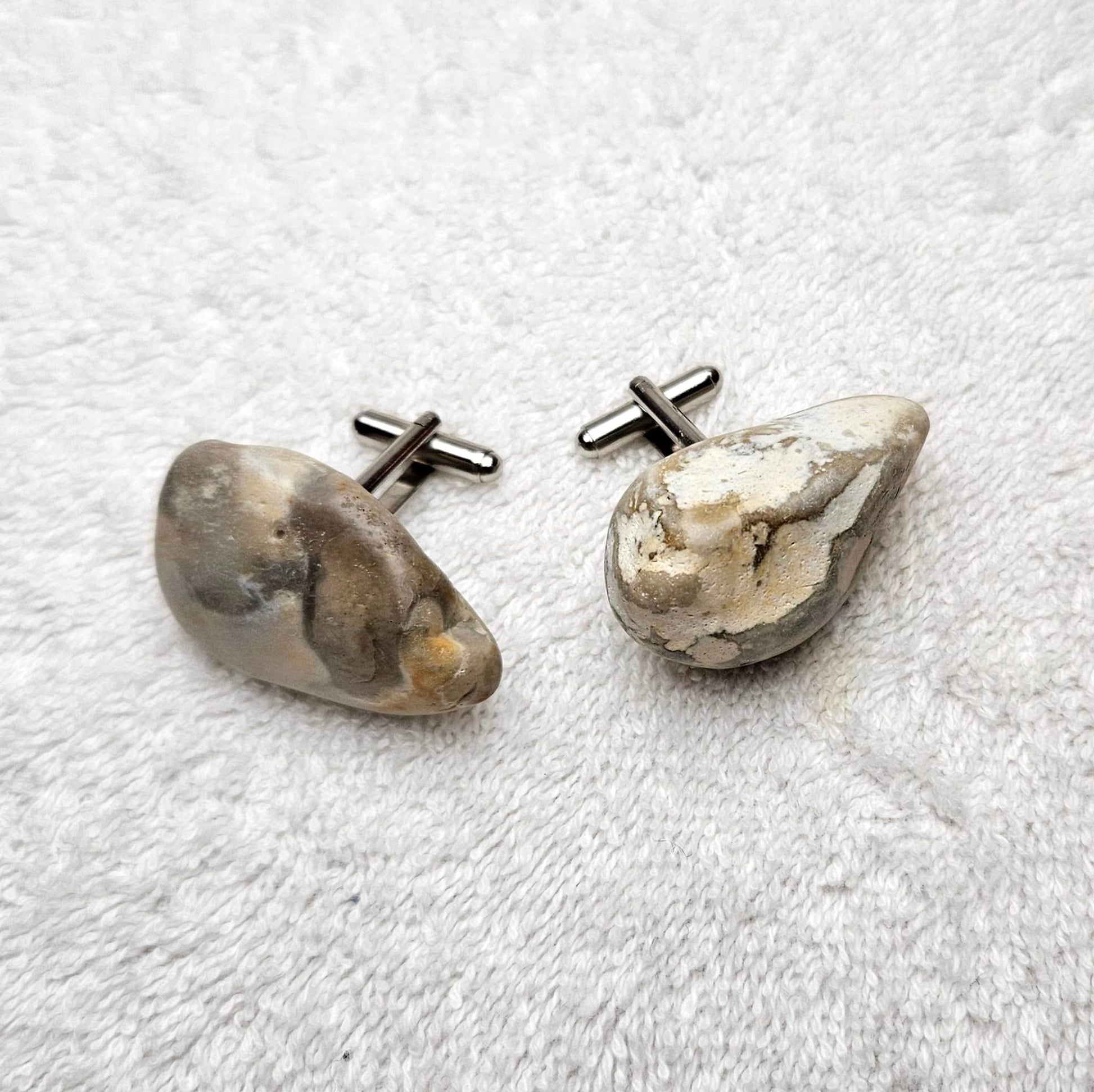 Image shows Brighton Rocks! Cufflinks designed by barnardandjestico . Stylish Cufflinks of natural polished stone ; from handmade process at my studio in Brighton Sussex England. For Menswear to show individual flair . Bold-sized ( 2-to-4cm ) natural shaped stones specialist-waxed and polished , then set on steel-studs . Homemade artisan methods of natural environmental materials