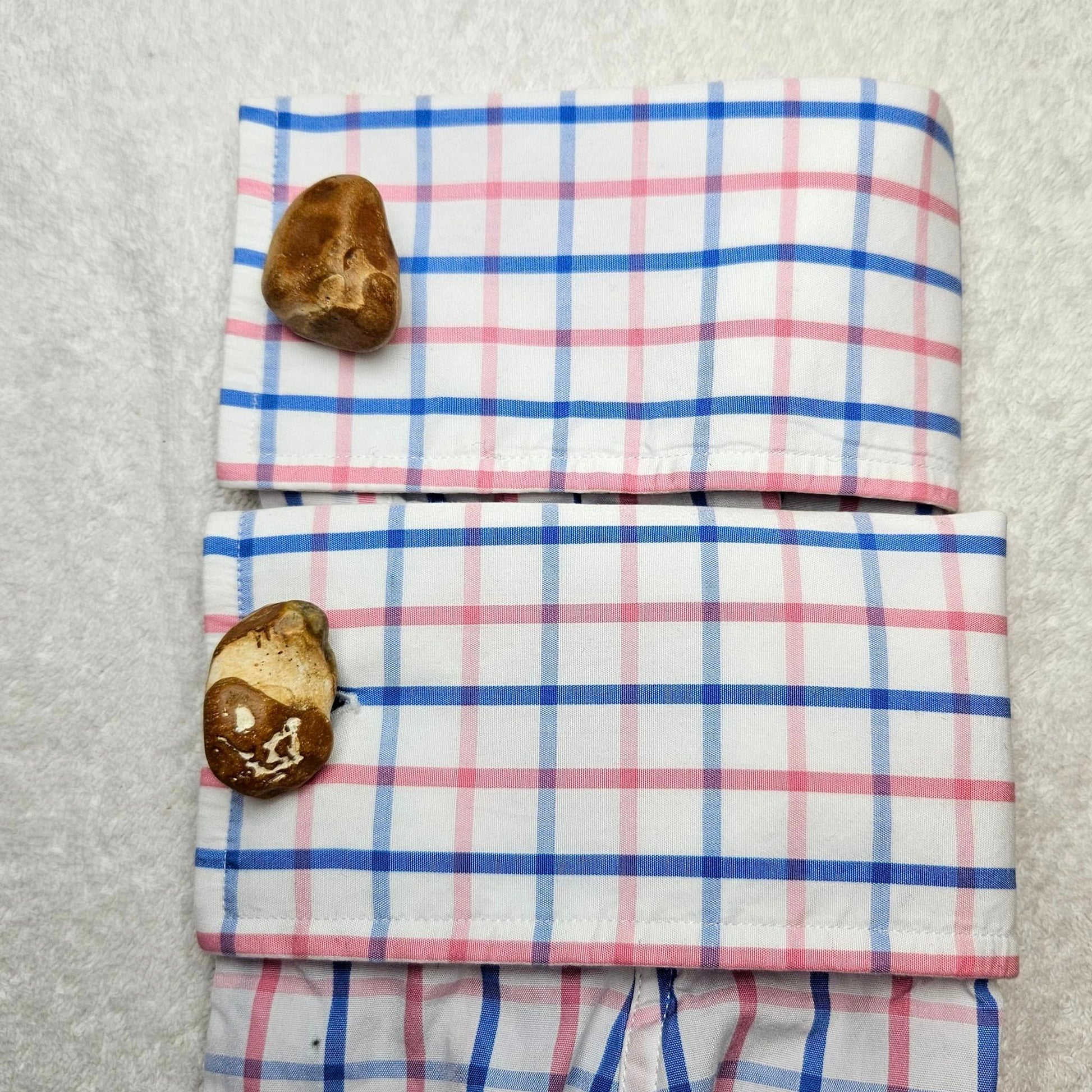 Image shows Brighton Rocks! Cufflinks designed by barnardandjestico . Stylish Cufflinks of natural polished stone ; from handmade process at my studio in Brighton Sussex England. For Menswear to show individual flair . Bold-sized ( 2-to-4cm ) natural shaped stones specialist-waxed and polished , then set on steel-studs . Homemade artisan methods of natural environmental materials