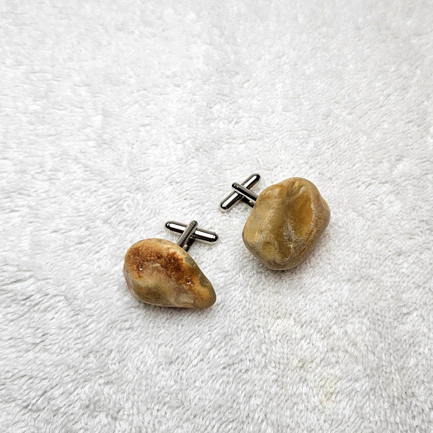 Image shows Brighton Rocks! Cufflinks designed by barnardandjestico . Stylish Cufflinks of natural polished stone ; from handmade process at my studio in Brighton Sussex England. For Menswear to show individual flair . Bold-sized ( 2-to-4cm ) natural shaped stones specialist-waxed and polished , then set on steel-studs . Homemade artisan methods of natural environmental materials