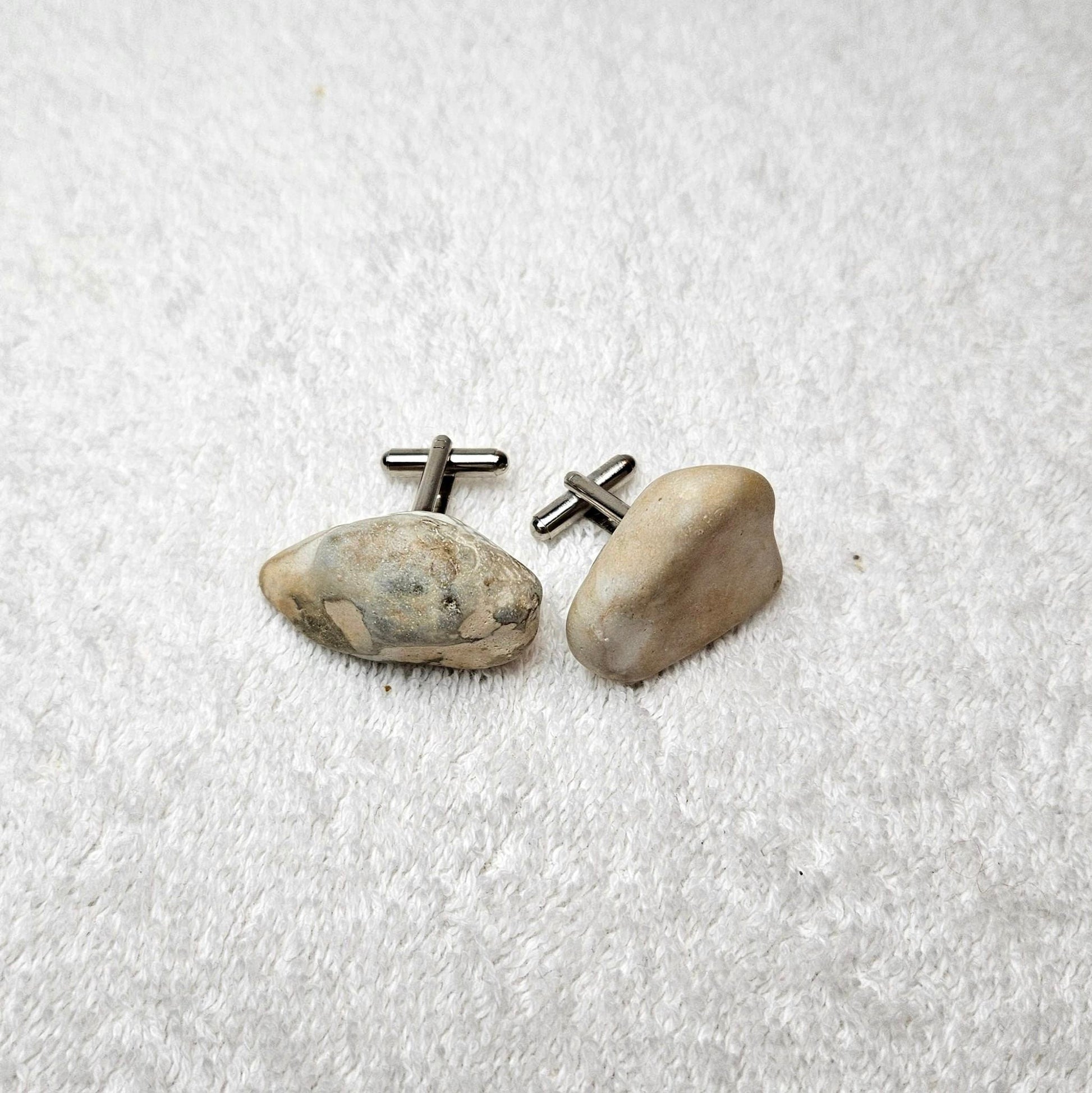 Image shows Brighton Rocks! Cufflinks designed by barnardandjestico . Stylish Cufflinks of natural polished stone ; from handmade process at my studio in Brighton Sussex England. For Menswear to show individual flair . Bold-sized ( 2-to-4cm ) natural shaped stones specialist-waxed and polished , then set on steel-studs . Homemade artisan methods of natural environmental materials