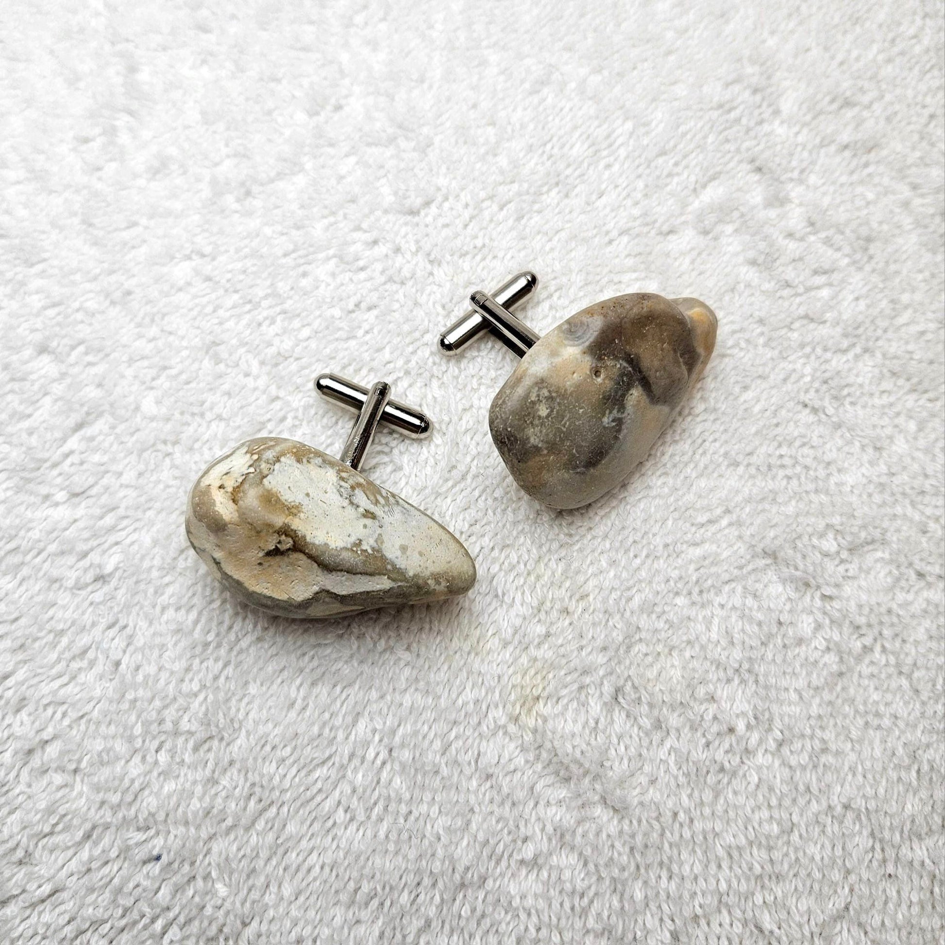 Image shows Brighton Rocks! Cufflinks designed by barnardandjestico . Stylish Cufflinks of natural polished stone ; from handmade process at my studio in Brighton Sussex England. For Menswear to show individual flair . Bold-sized ( 2-to-4cm ) natural shaped stones specialist-waxed and polished , then set on steel-studs . Homemade artisan methods of natural environmental materials