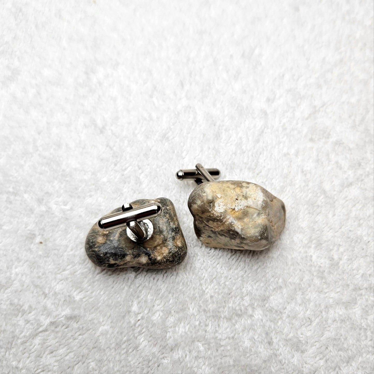 Image shows Brighton Rocks! Cufflinks designed by barnardandjestico . Stylish Cufflinks of natural polished stone ; from handmade process at my studio in Brighton Sussex England. For Menswear to show individual flair . Bold-sized ( 2-to-4cm ) natural shaped stones specialist-waxed and polished , then set on steel-studs . Homemade artisan methods of natural environmental materials